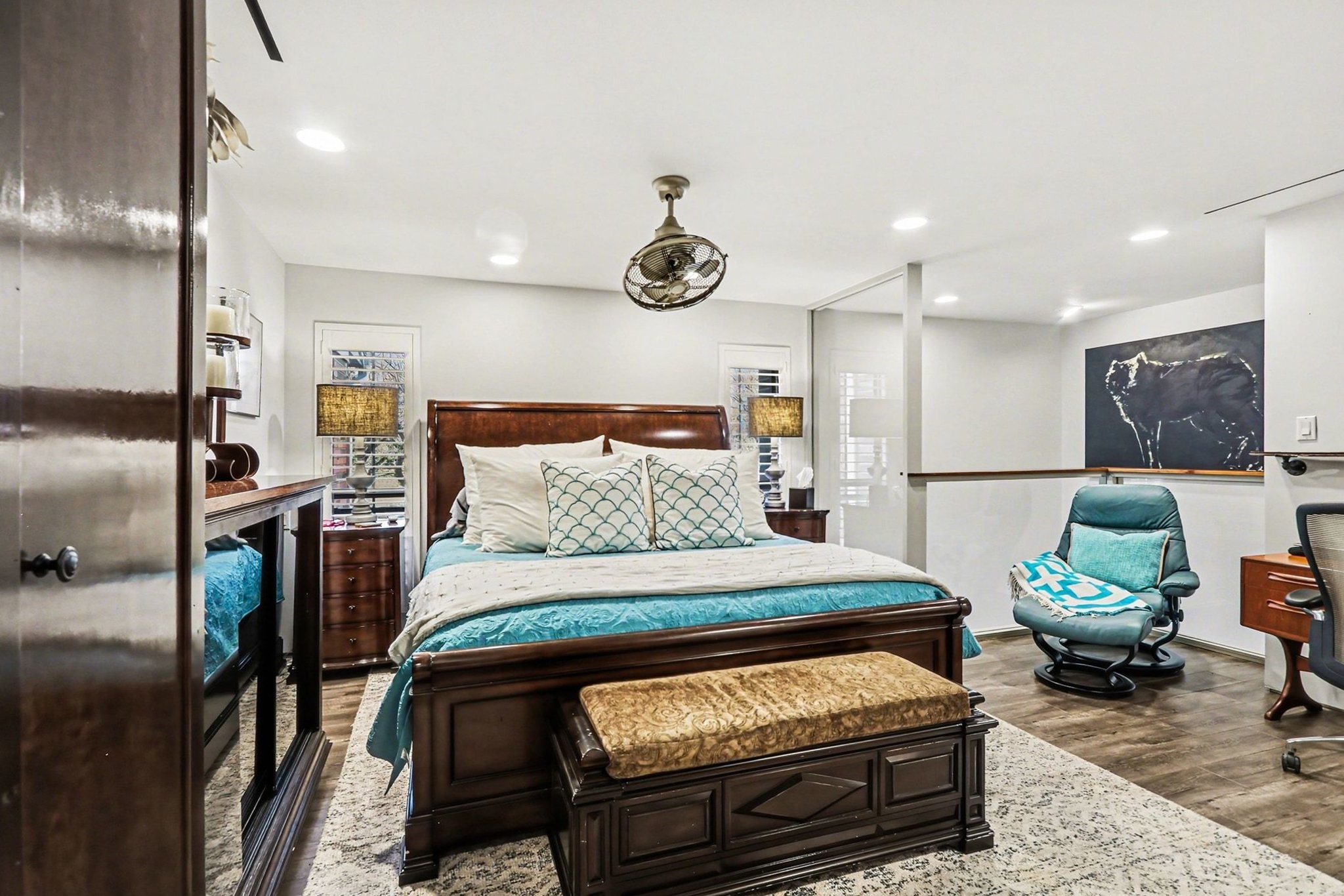 9407 Fondren Road Houston, TX 77074 - Photo 14 of 30 a bedroom with furniture and a chandelier