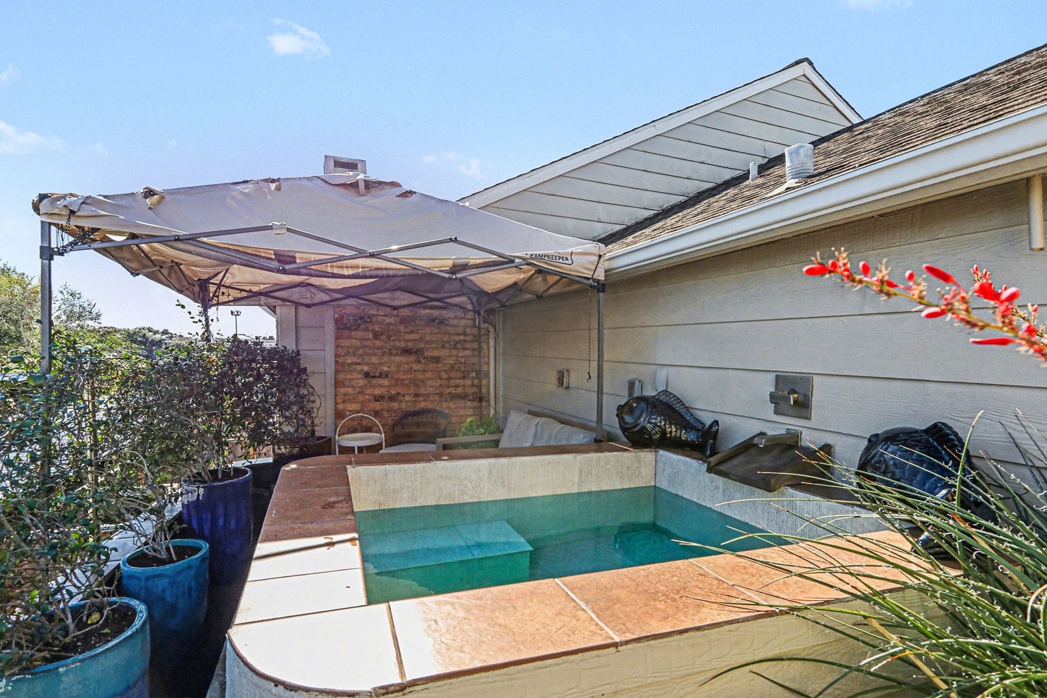 9407 Fondren Road Houston, TX 77074 - Photo 22 of 30 a view of a patio with table and chairs potted plants