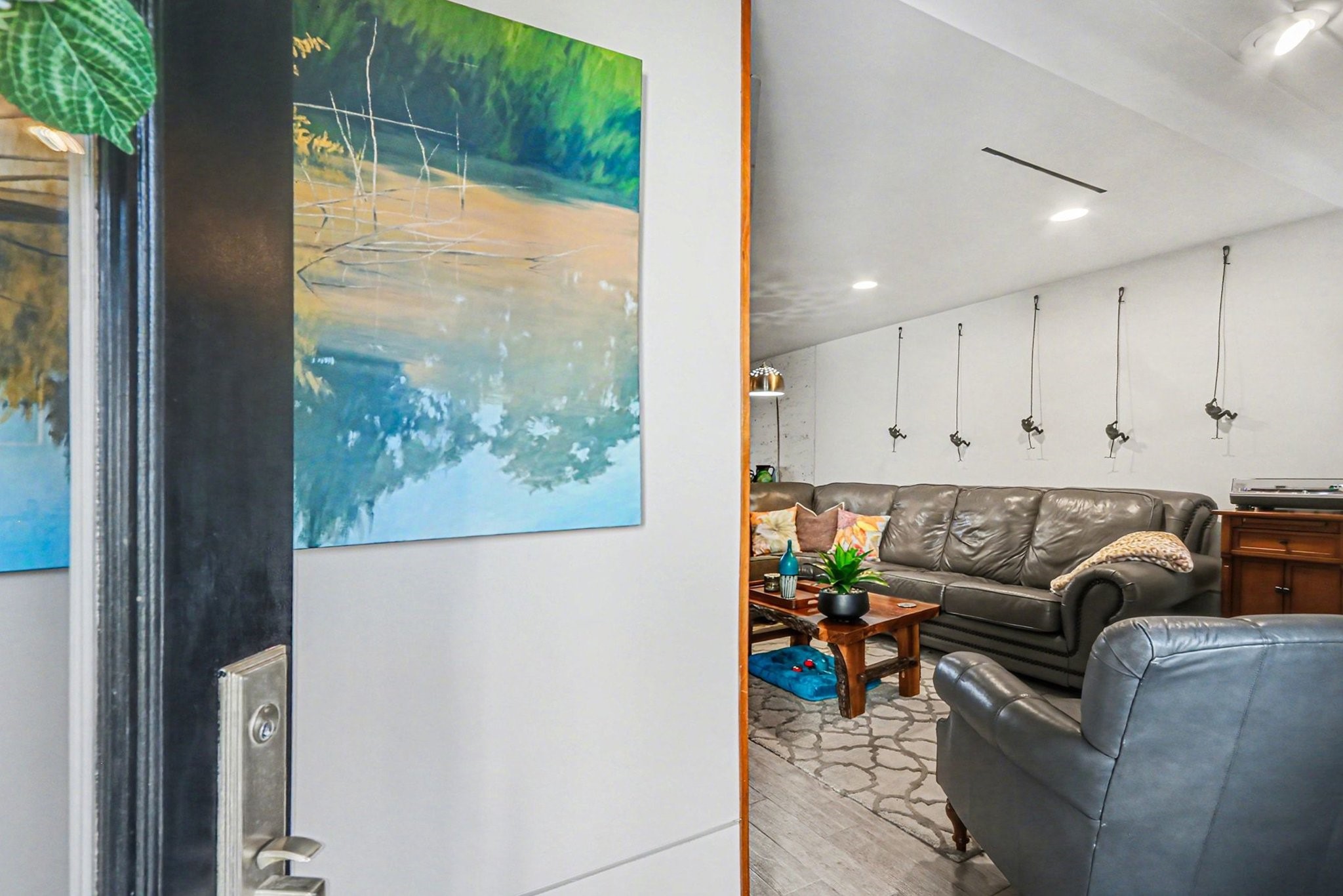 9407 Fondren Road Houston, TX 77074 - Photo 3 of 30 a living room with furniture and a potted plant