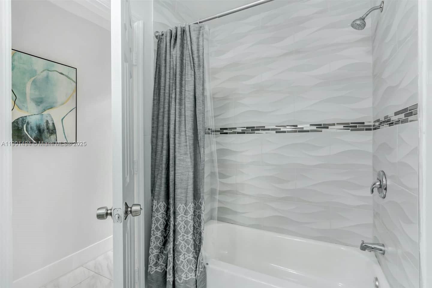 211 Southwest 4 Avenue Hallandale Beach, FL 33009 - Photo 13 of 25 a bathroom with a shower