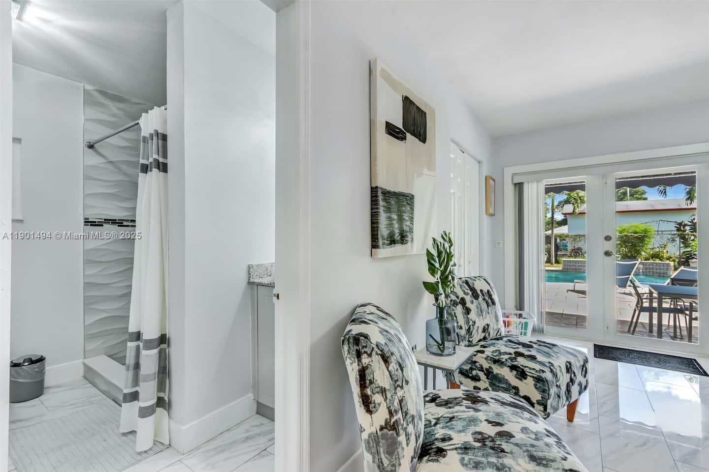 211 Southwest 4 Avenue Hallandale Beach, FL 33009 - Photo 14 of 25 a view of a livingroom with furniture and floor to ceiling window