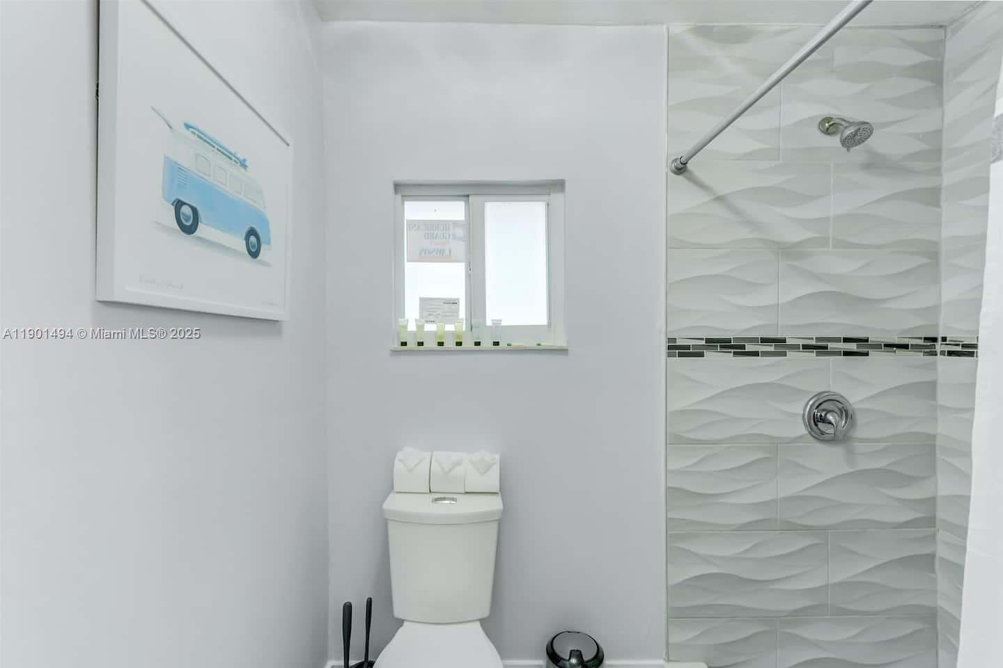 211 Southwest 4 Avenue Hallandale Beach, FL 33009 - Photo 15 of 25 a bathroom with a toilet and a shower