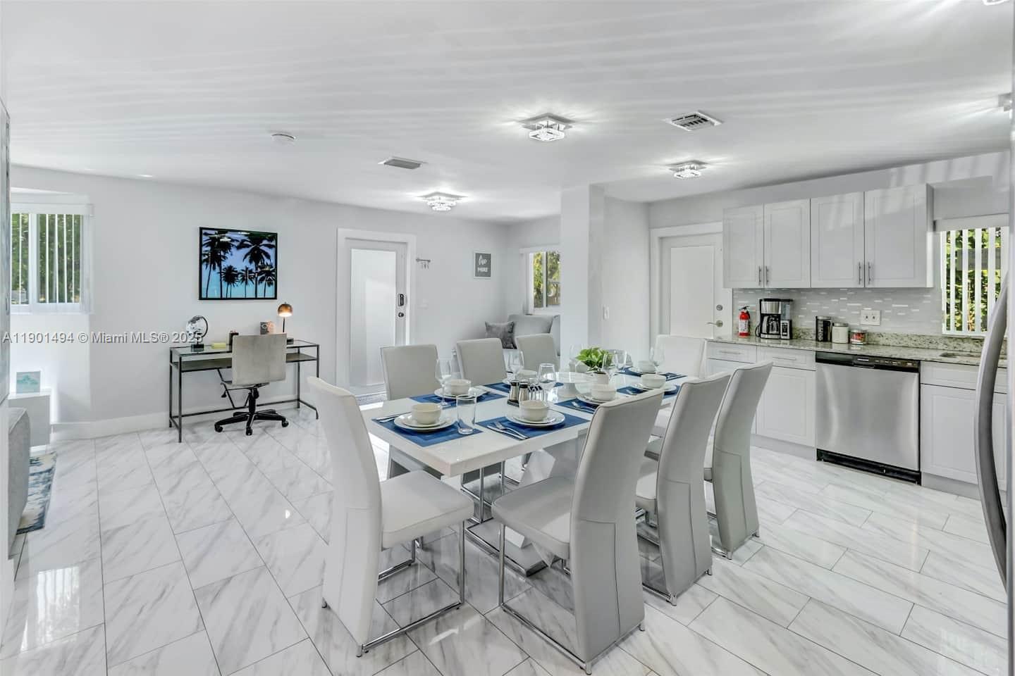 211 Southwest 4 Avenue Hallandale Beach, FL 33009 - Photo 2 of 25 a view of a dining room with furniture and a wooden floor