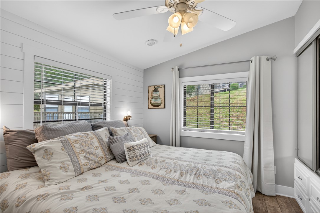 1230 Melton Road, Unit 4 West Union, SC 29696 - Photo 26 of 48 A cozy bedroom with bright windows and warm shiplap accents awaits.