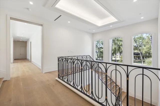 a view of a hallway with windows