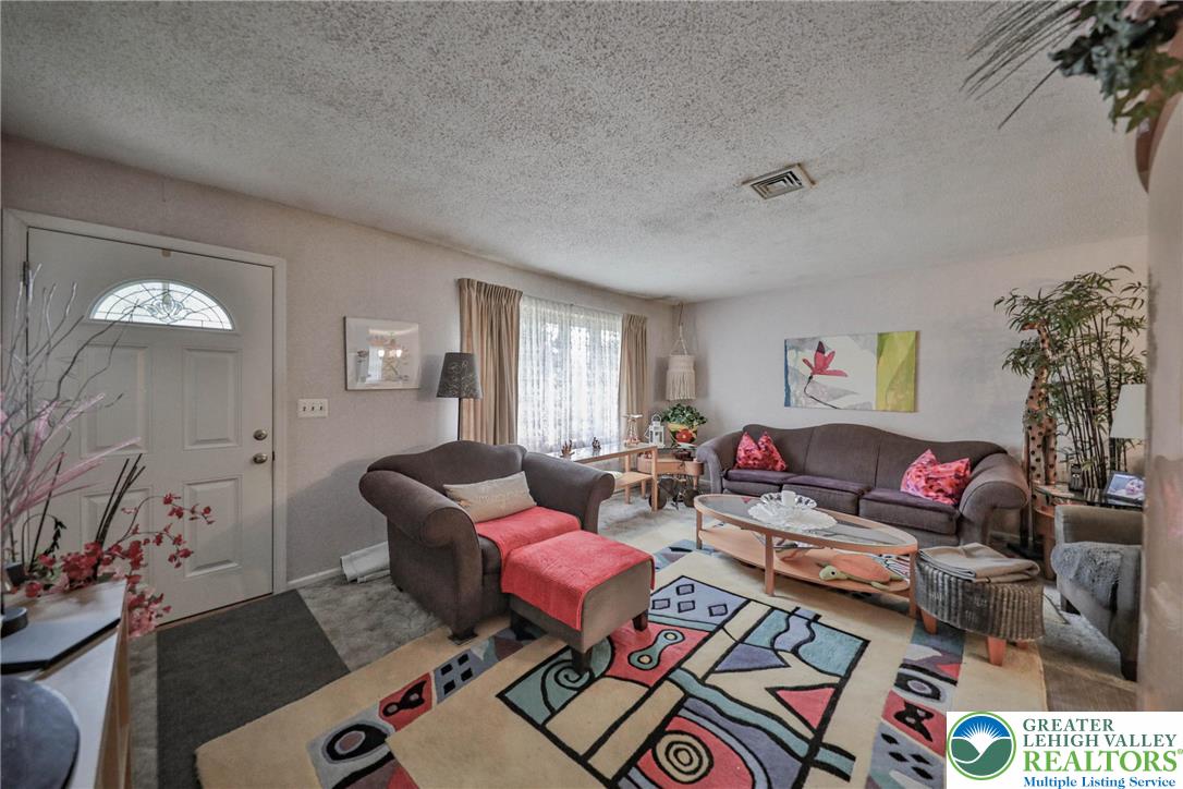 1502 2nd Street Bethlehem, PA 18020 - Photo 13 of 62 a living room with furniture and a potted plant