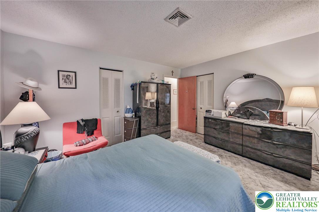 1502 2nd Street Bethlehem, PA 18020 - Photo 22 of 62 a bed room with a bed and a dresser