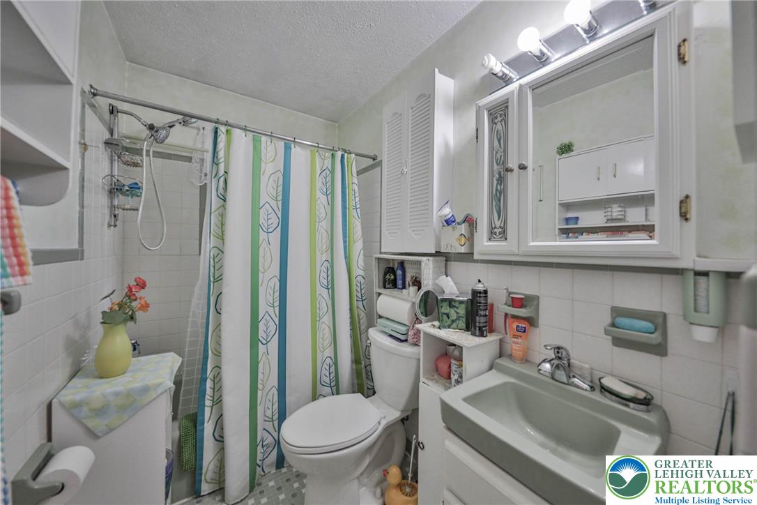 1502 2nd Street Bethlehem, PA 18020 - Photo 29 of 62 a bathroom with a sink toilet and shower
