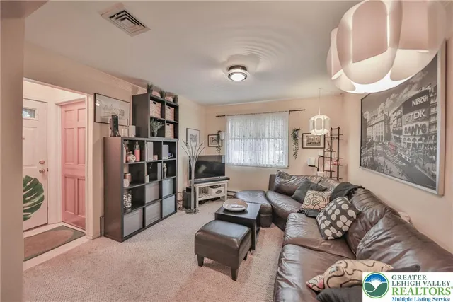 a kitchen with a refrigerator and a stove