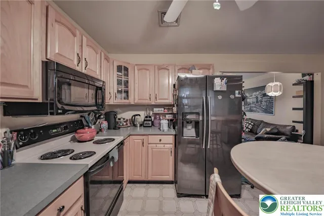 a view of a patio with table and chairs potted plants with wooden floor