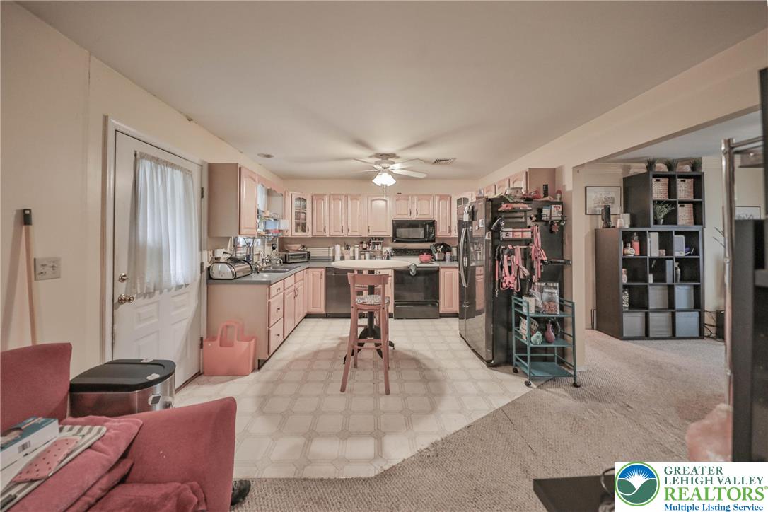 1502 2nd Street Bethlehem, PA 18020 - Photo 46 of 62 a living room with lots of furniture and kitchen view