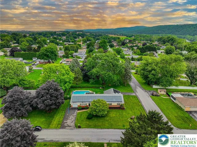 a view of a garden with a building in the background