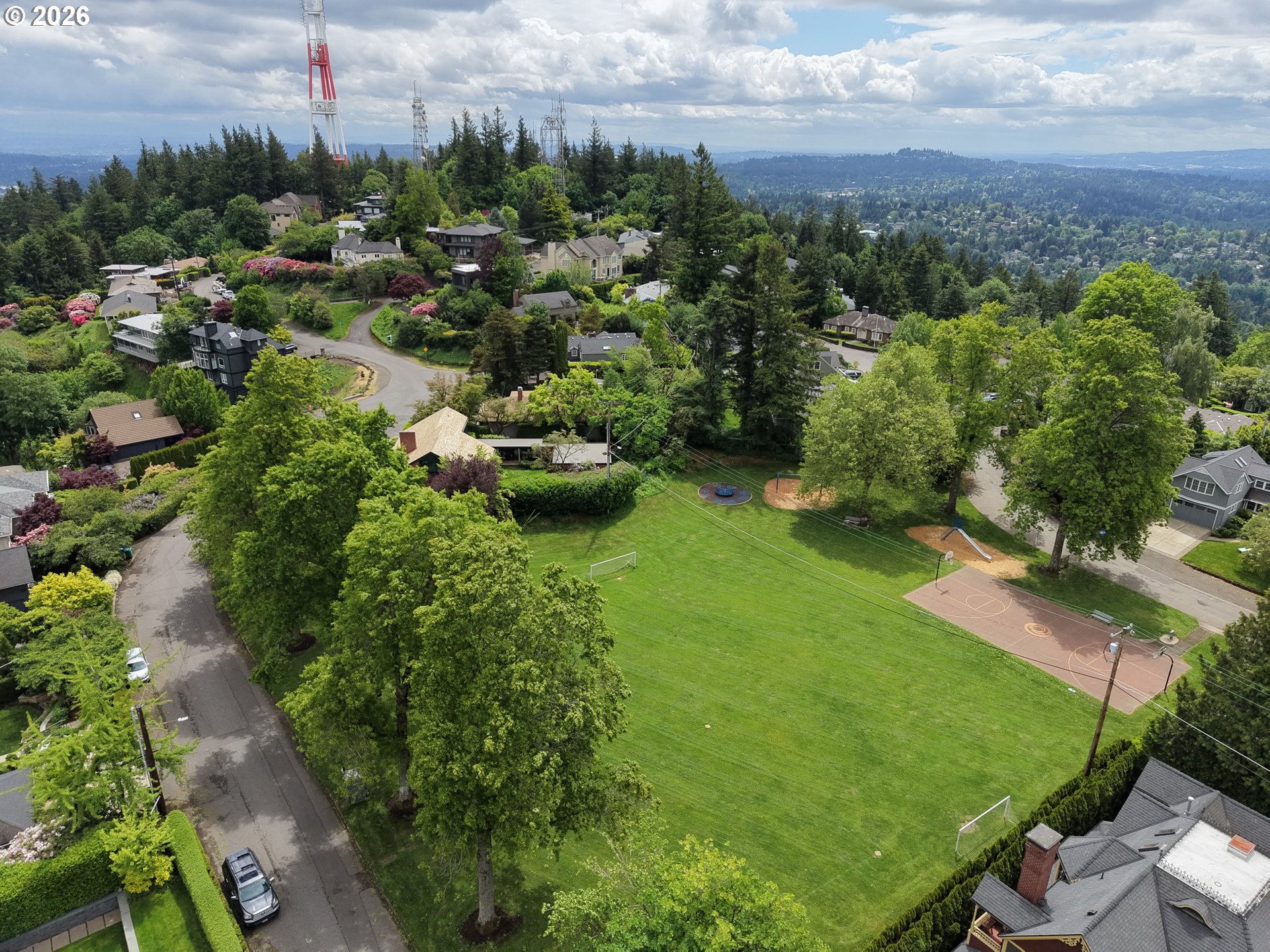 0 Southwest Mcdonnell Portland, OR 97239 - Photo 11 of 17 a view of a garden with a building in the background