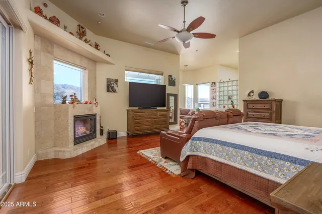 a bedroom with furniture and wooden floor