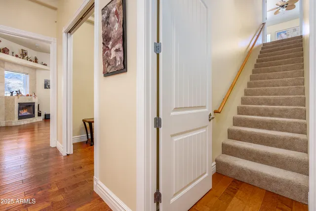 a room with pool table and windows