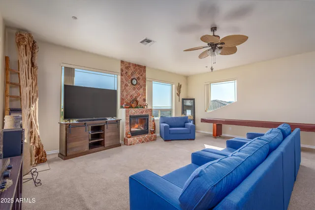 a spacious bedroom with a bed and a chandelier