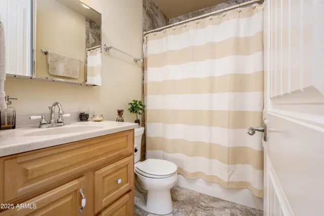 a view of a storage and utility room with washer and dryer