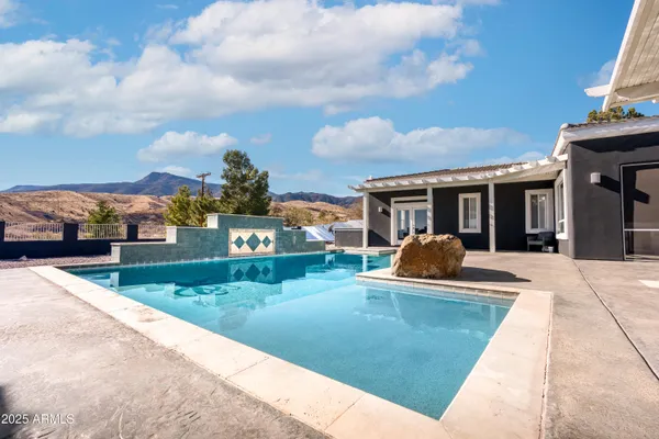 front view of a house with a swimming pool