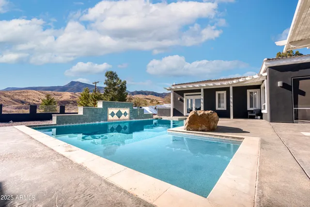 front view of a house with a swimming pool