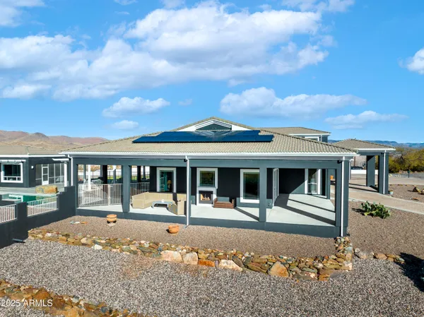 a view of a house with a swimming pool