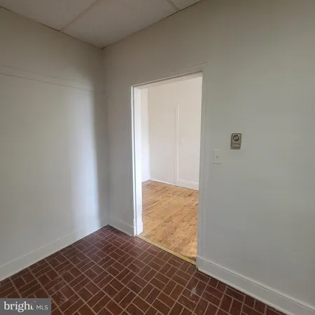 a bathroom with a white bath tub and a shower curtain