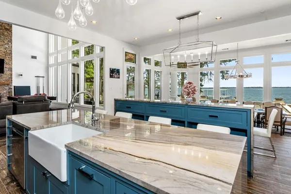 a kitchen with stainless steel appliances granite countertop a stove and a refrigerator