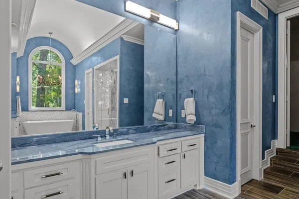 a view of an empty room with a chandelier