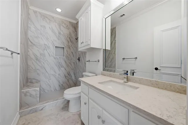 a spacious bathroom with a sink and a mirror