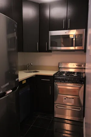 a kitchen with a stove and a microwave