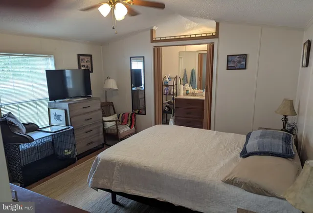 a bedroom with a bed and furniture