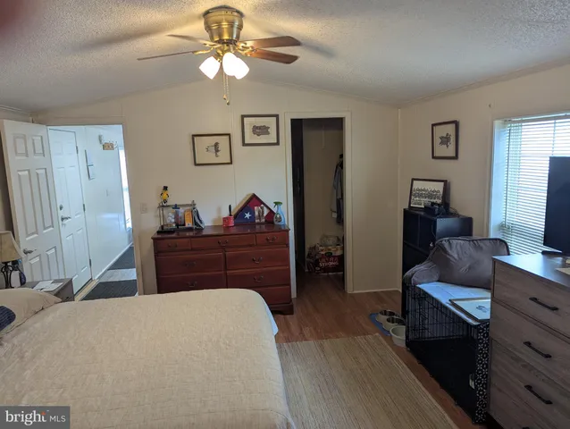 a bed room with a bed and a television