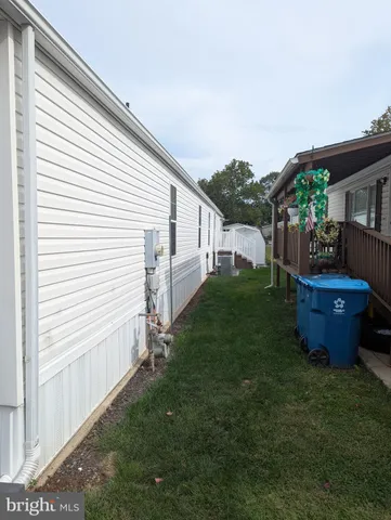 a view of a backyard with table and chairs