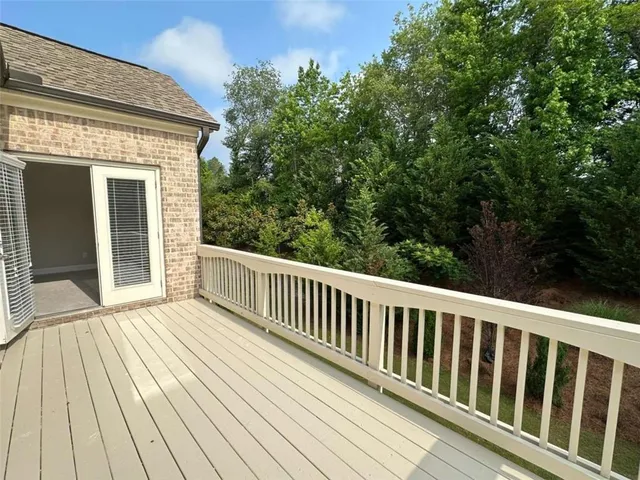 a bathroom with a shower and a sink a mirror