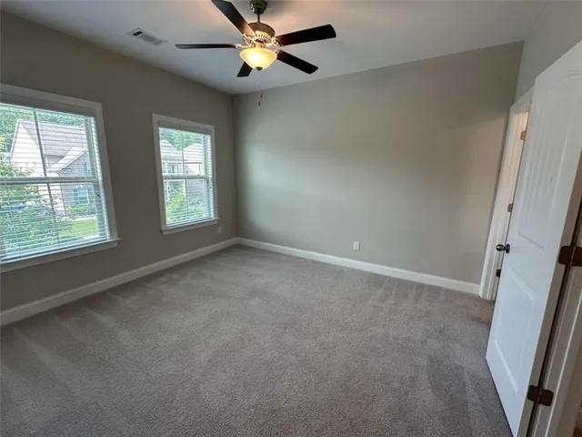 an empty room with a bathroom