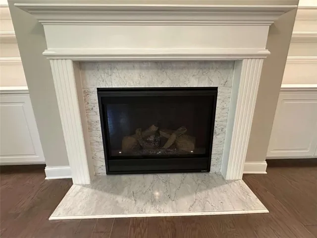 a room with cabinets and a fireplace