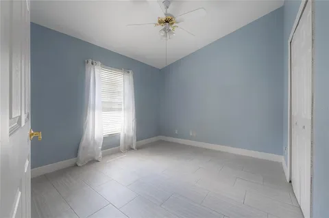 a view of an empty room with a window