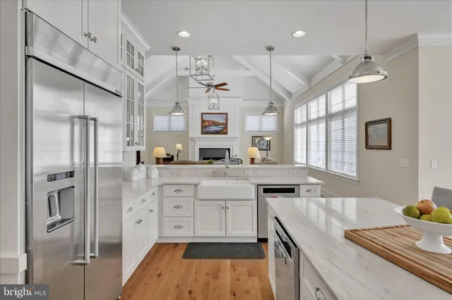 a kitchen with stainless steel appliances granite countertop a stove and a microwave