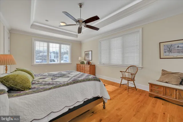 a bathroom with a granite countertop sink toilet and mirror