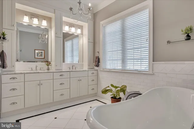 a view of a hallway with wooden floor and stairs