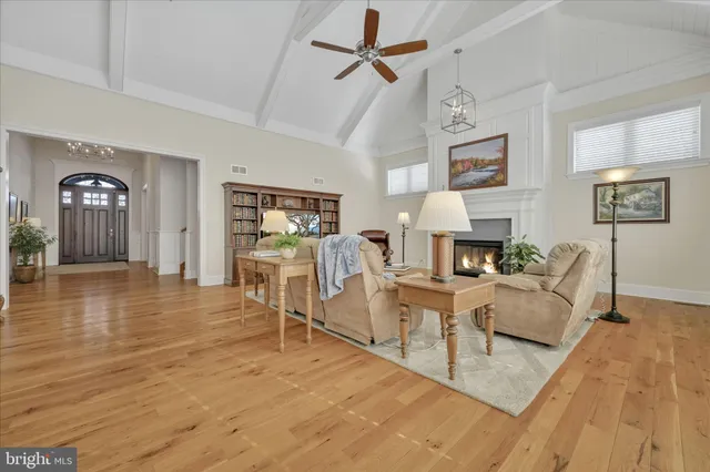 a living room with furniture and a lamp