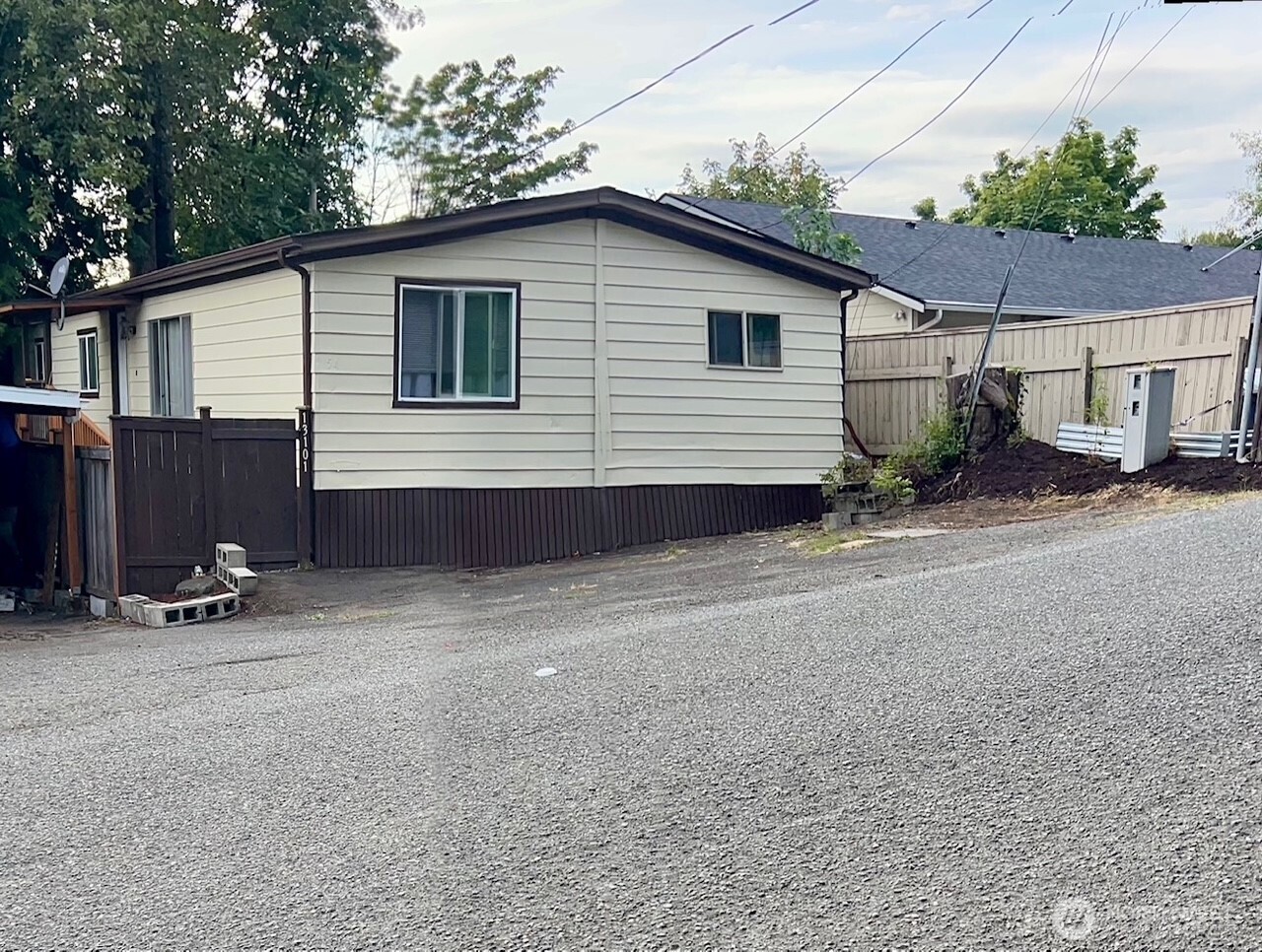 13101 64th Avenue South Seattle, WA 98178 - Photo 1 of 34 a view of a house with backyard and parking space