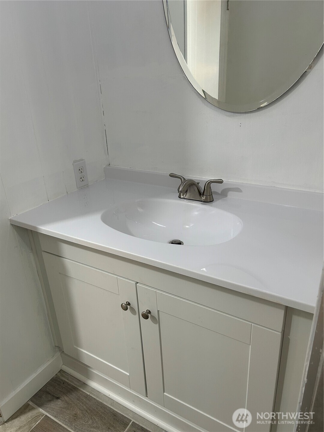 13101 64th Avenue South Seattle, WA 98178 - Photo 18 of 34 a bathroom with a sink and a mirror