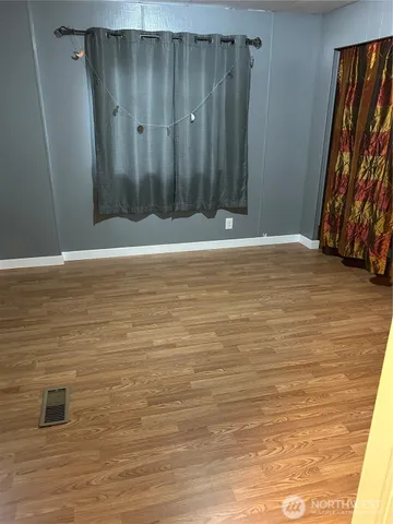 a front view of a house with parking space