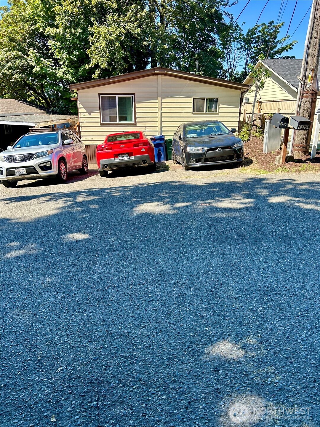 13101 64th Avenue South Seattle, WA 98178 - Photo 30 of 34 a front view of a house with parking space