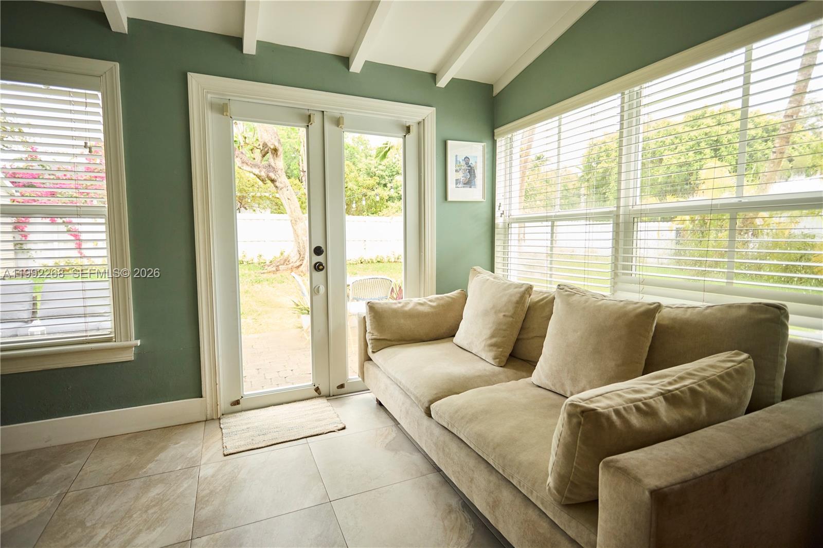 5755 Devonshire Boulevard, Unit 5755 Miami, FL 33155 - Photo 11 of 30 a living room with furniture and a large window