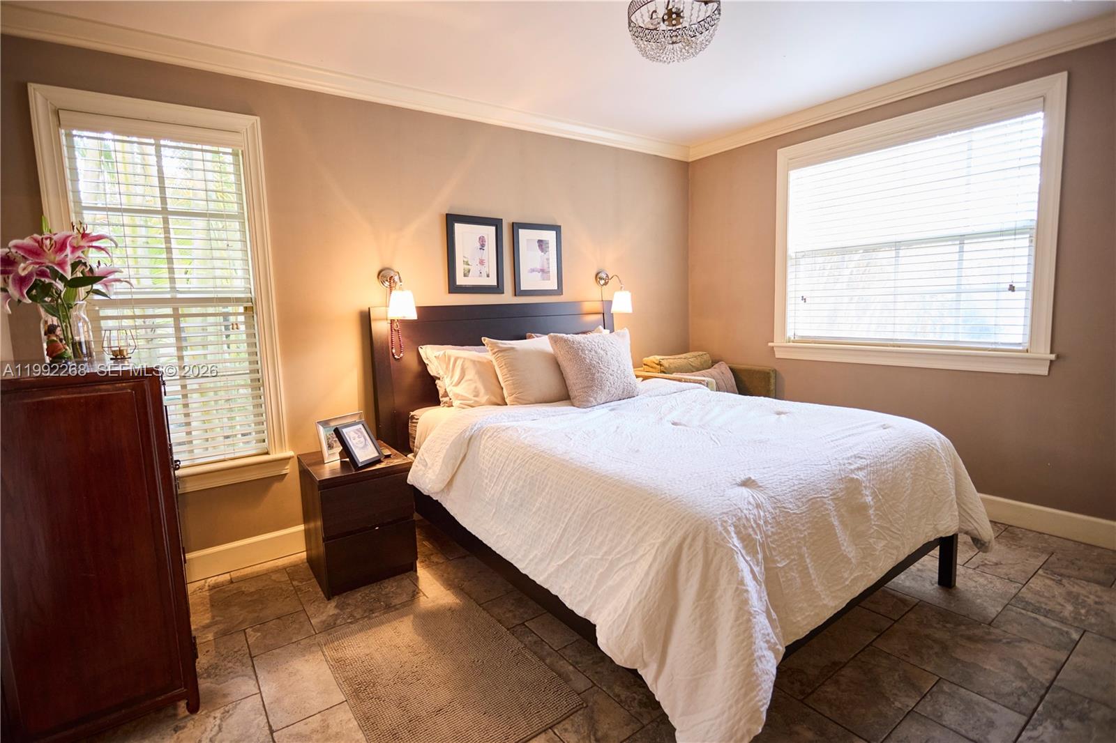 5755 Devonshire Boulevard, Unit 5755 Miami, FL 33155 - Photo 15 of 30 a bedroom with a bed and window
