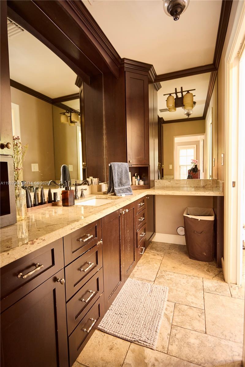 5755 Devonshire Boulevard, Unit 5755 Miami, FL 33155 - Photo 18 of 30 a large kitchen with a sink and cabinets