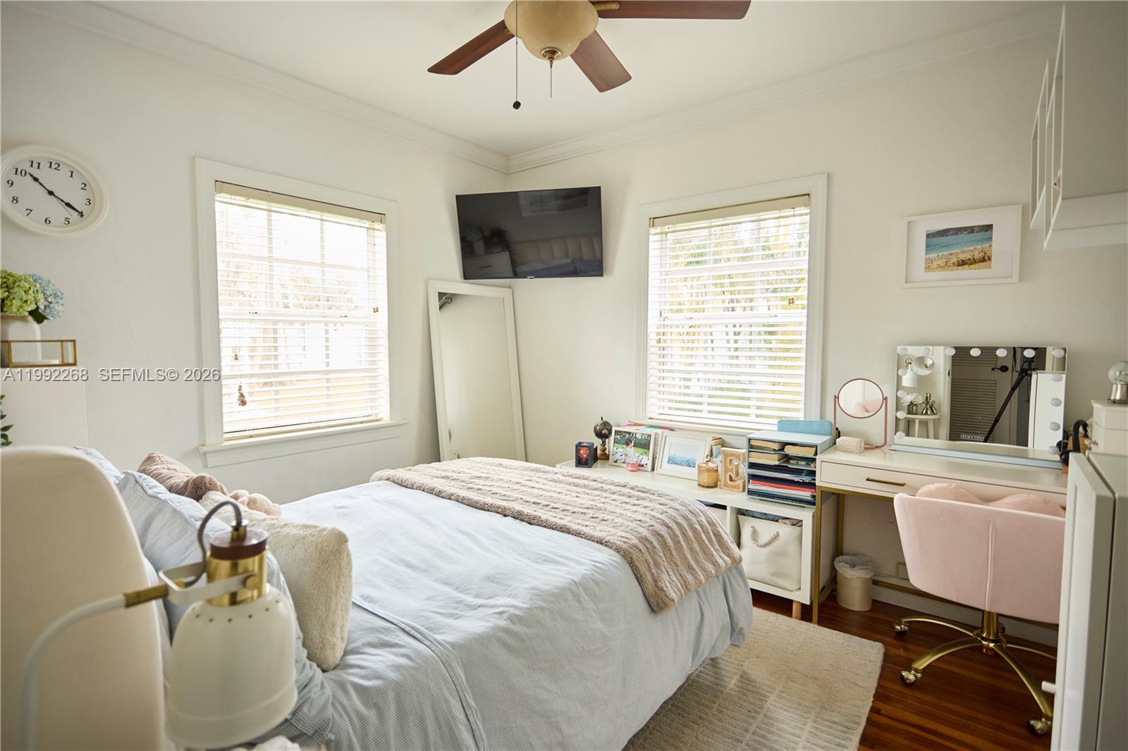 5755 Devonshire Boulevard, Unit 5755 Miami, FL 33155 - Photo 19 of 30 a bedroom with a bed dresser and a window