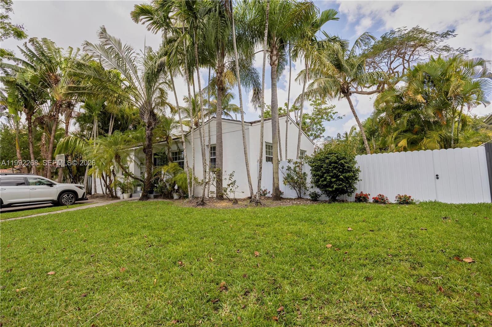 5755 Devonshire Boulevard, Unit 5755 Miami, FL 33155 - Photo 27 of 30 a view of a yard with cars