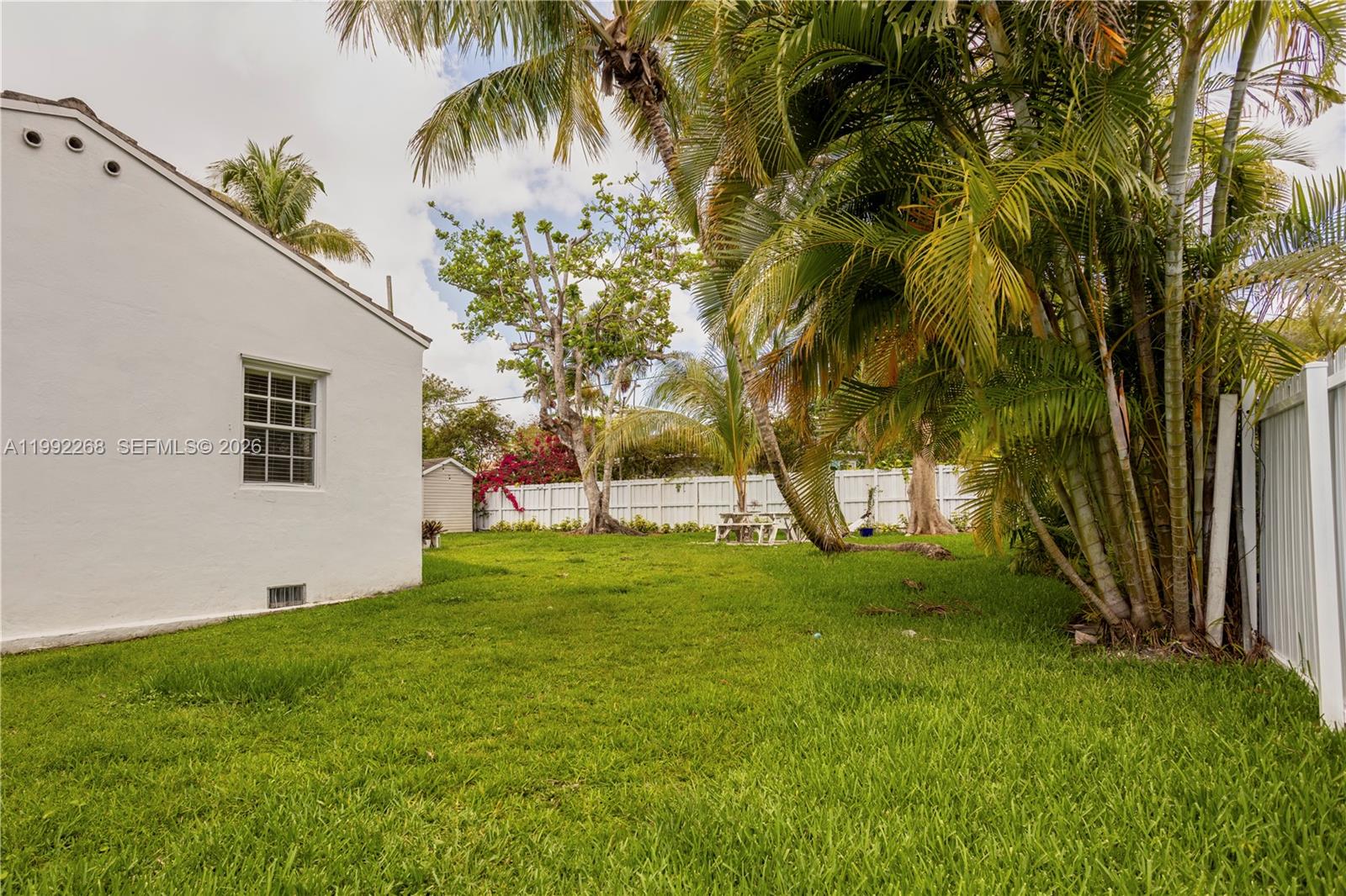 5755 Devonshire Boulevard, Unit 5755 Miami, FL 33155 - Photo 28 of 30 a view of a backyard with a large tree